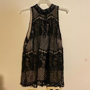 Fancy top that buttons in the back of the neck